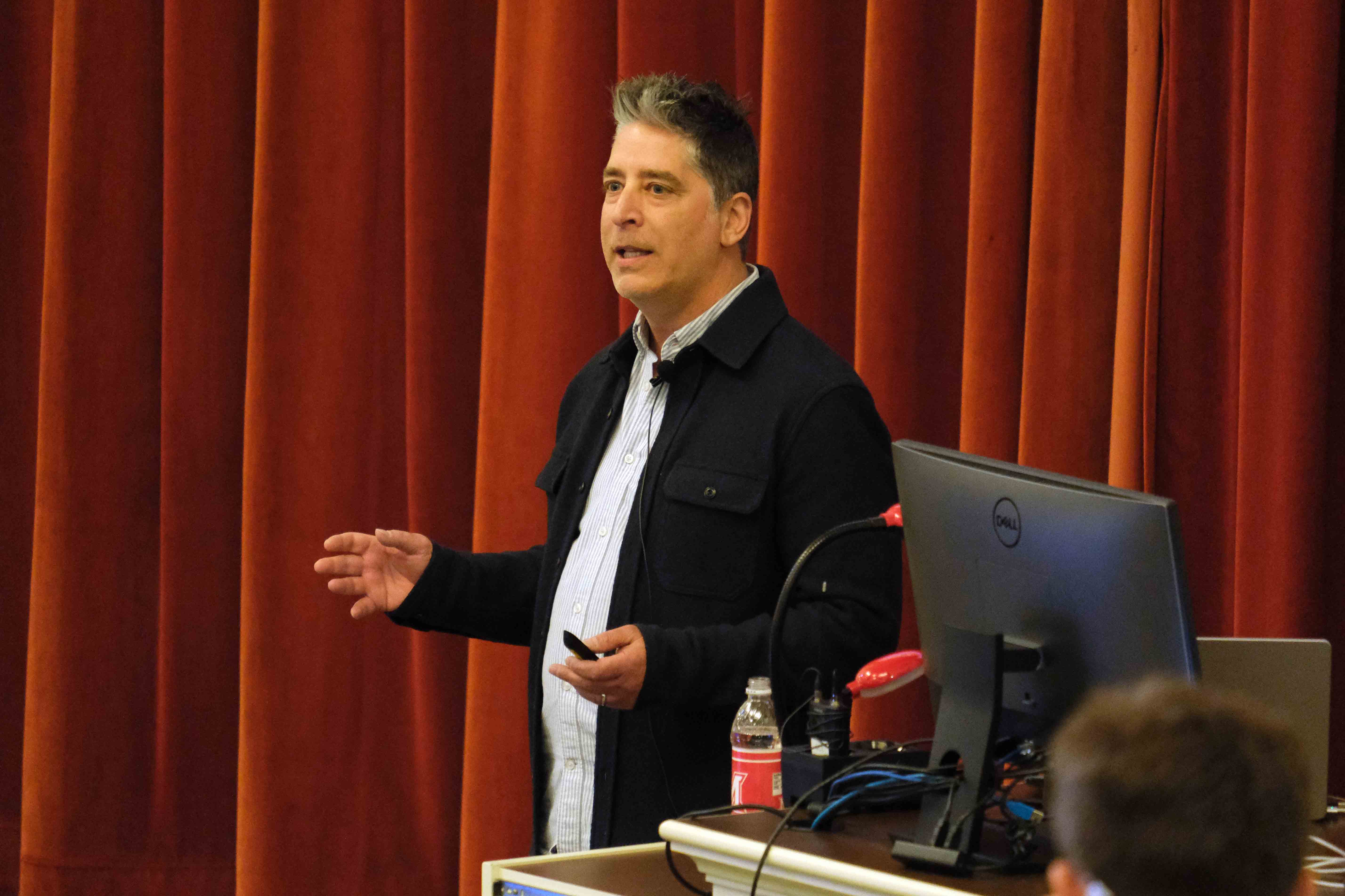 Craig Miller talking with students