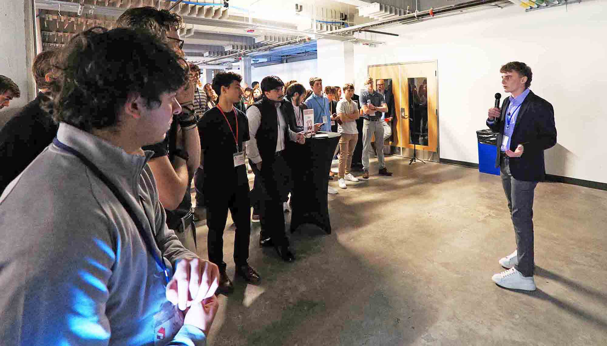Student founder pitches product idea to attendees