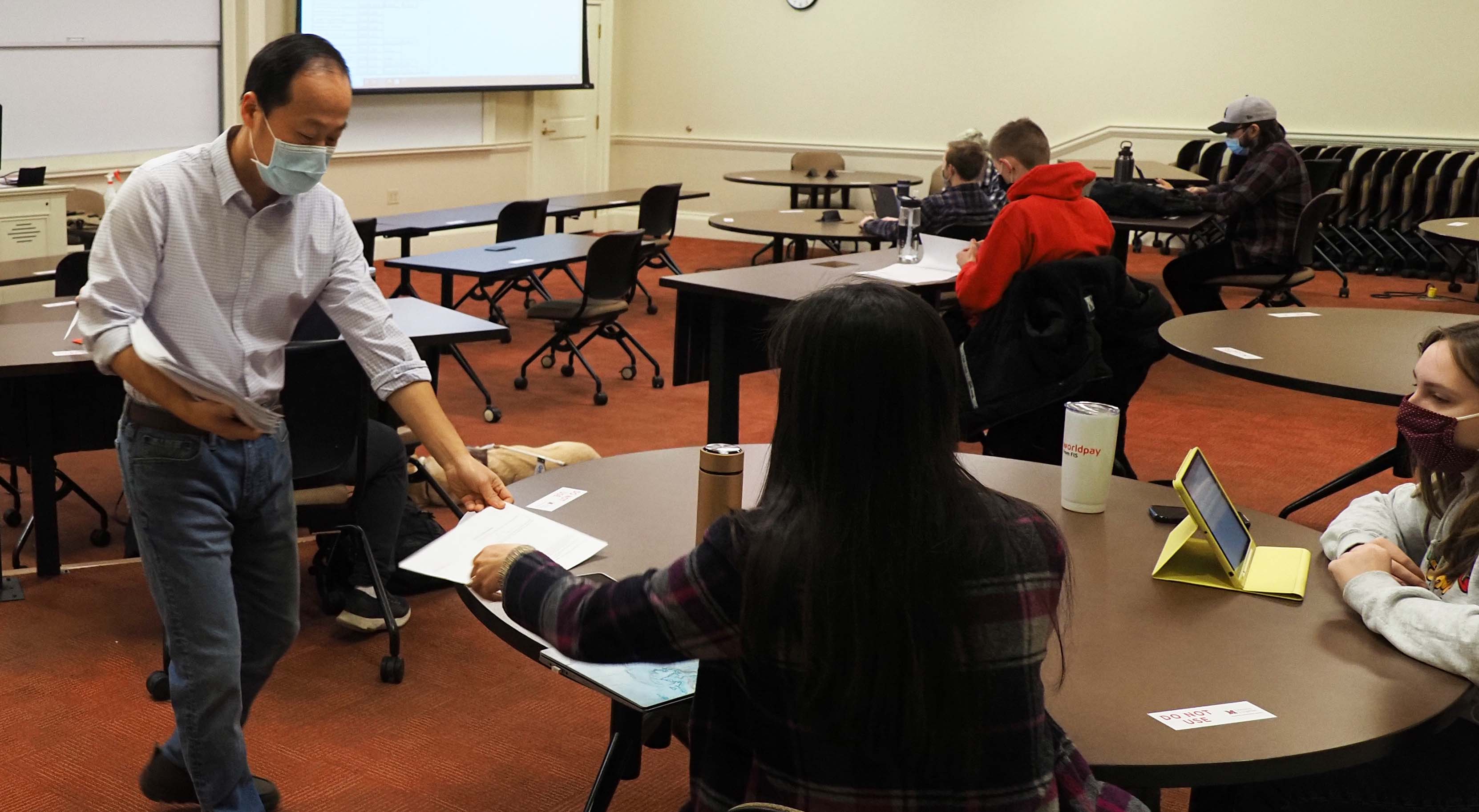 Professor interacting with students during covid