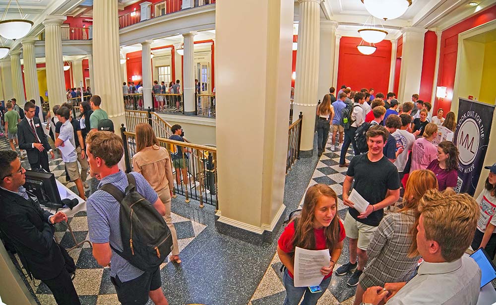 Wide shot of the FSB atrium filled with students