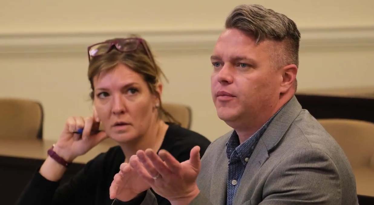 Man asking question during presentation