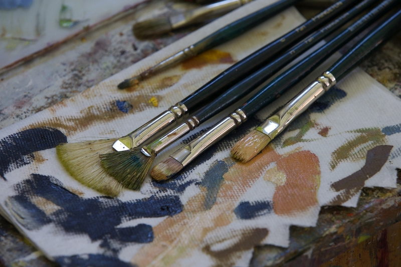Paintbrushes on Canvas with Paint