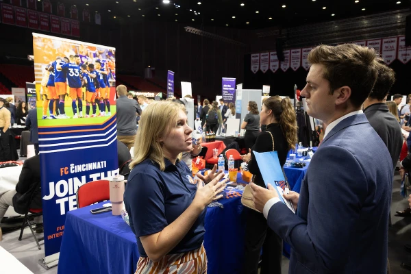 student with company representative at career fair