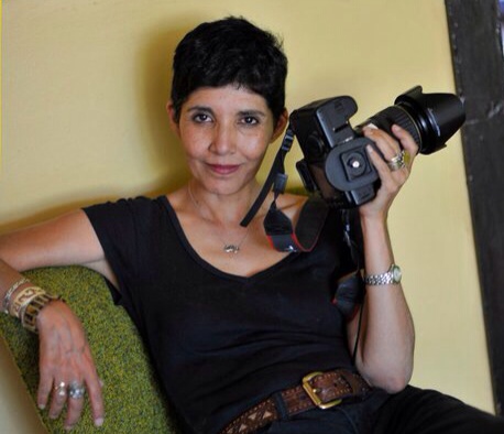 Ligia Cuevas holding her camera