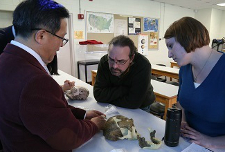 Dr. Gao presenting stone tools from Zhoukoudian site