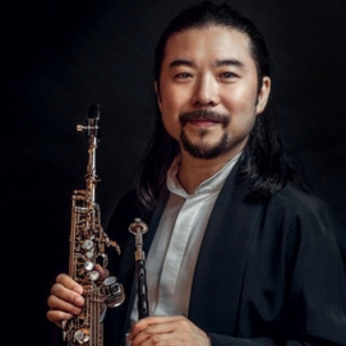 Yazhi holding a Chinese musical instrument