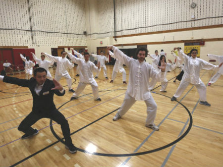 Taiji group practicing with instructor