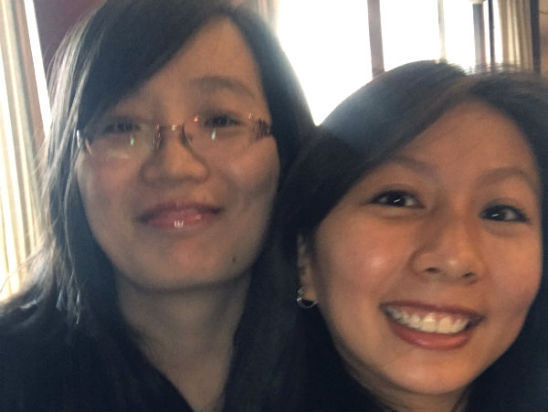 Xin Dong smiling with her teacher
