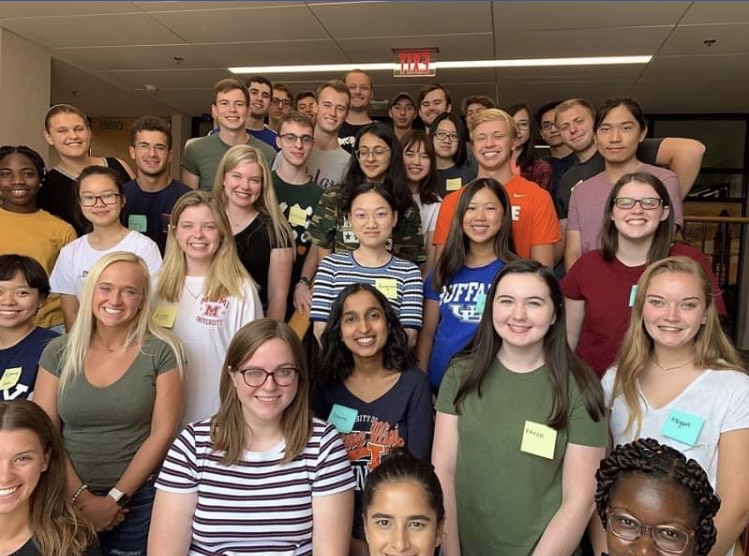 Karen standing with a group of students