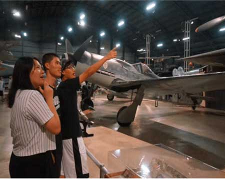 A group at the Air Force Museum looks at exhibits