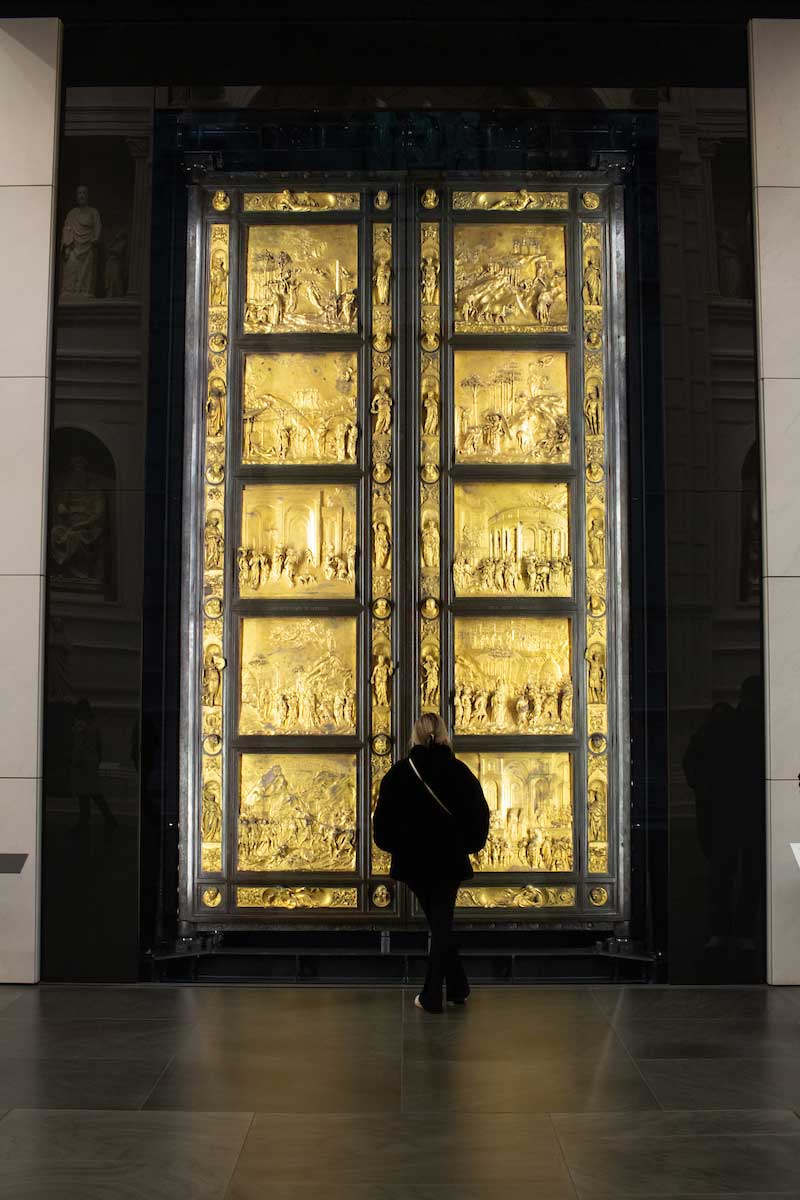 Student viewing sculpture display in Italy