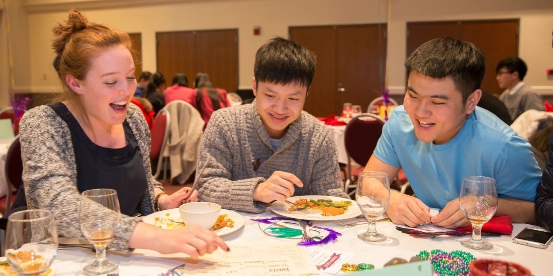 students at a table in discussion