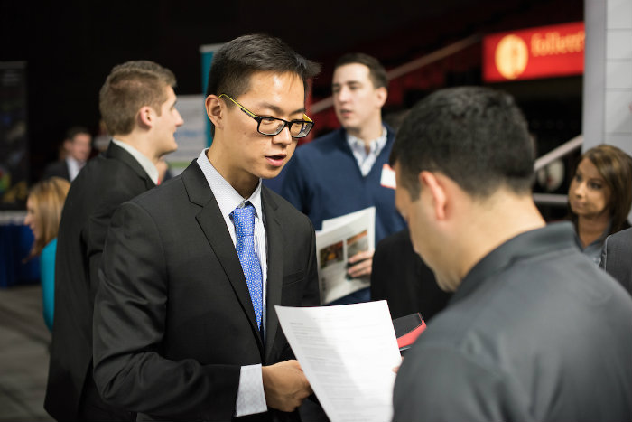 Students meet with potential employers at a Miami career fair