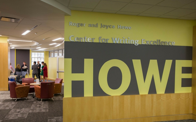 Mural of the Howe Center logo on a wall in the library