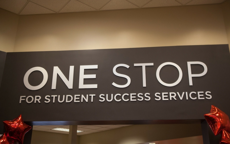 The logo of the Student Success Center found on a wall within the office's lobby