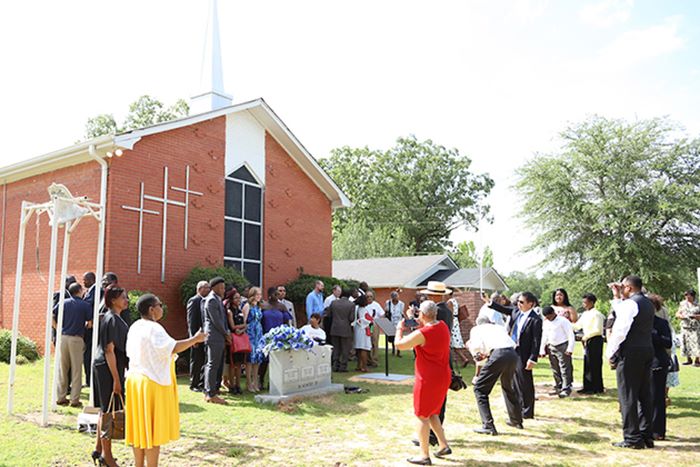 Miami students and community members gathering outside of a church