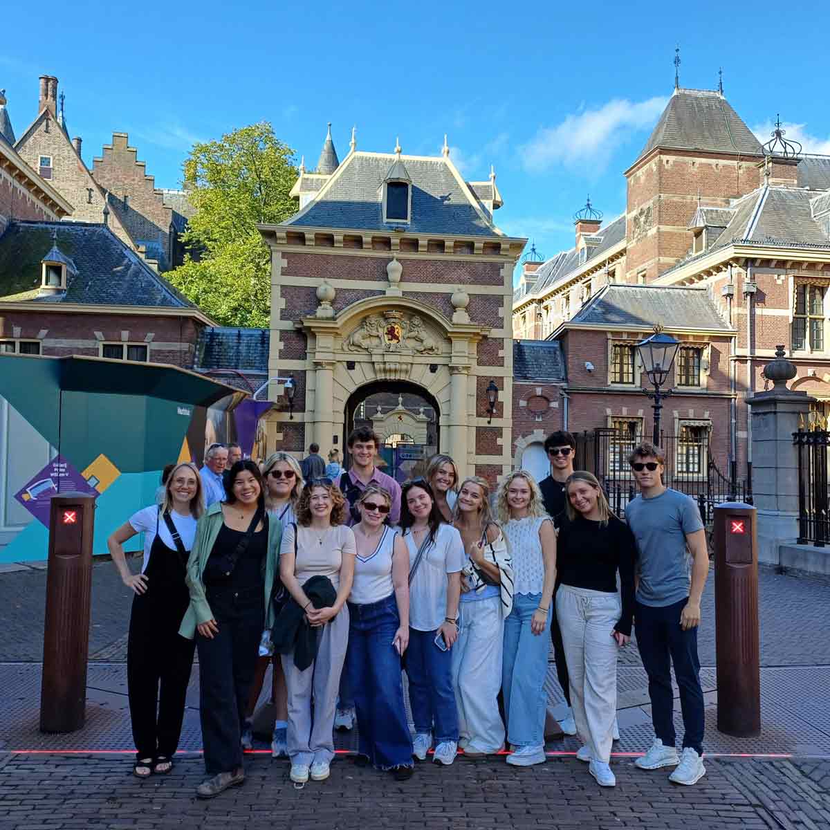 students gathered for a picture at a crosswalk
