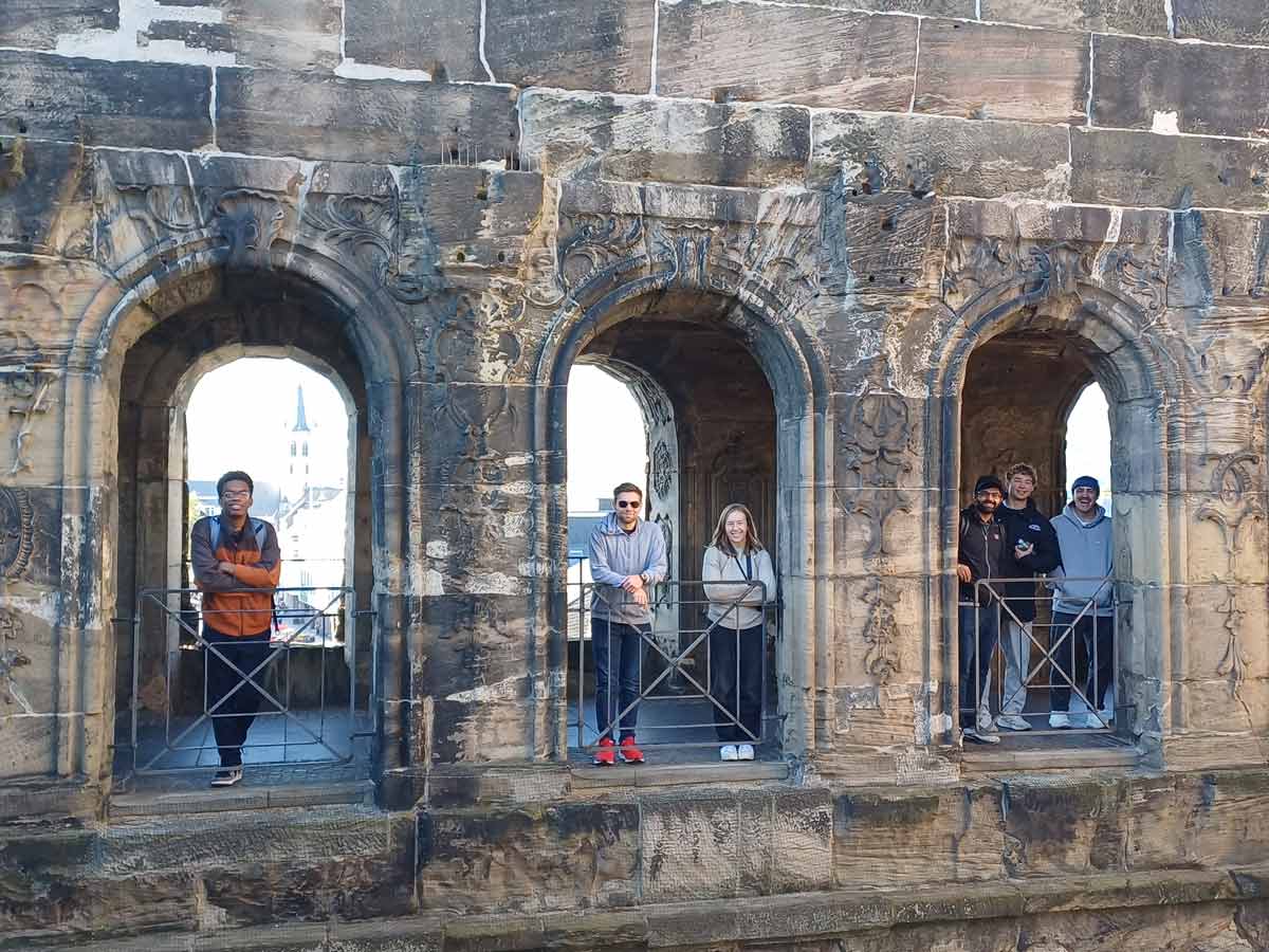 students standing in window openings