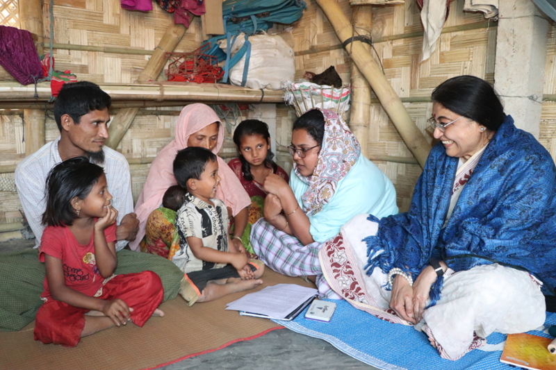 Dr. Fauzia Ahmed interviewing a family.
