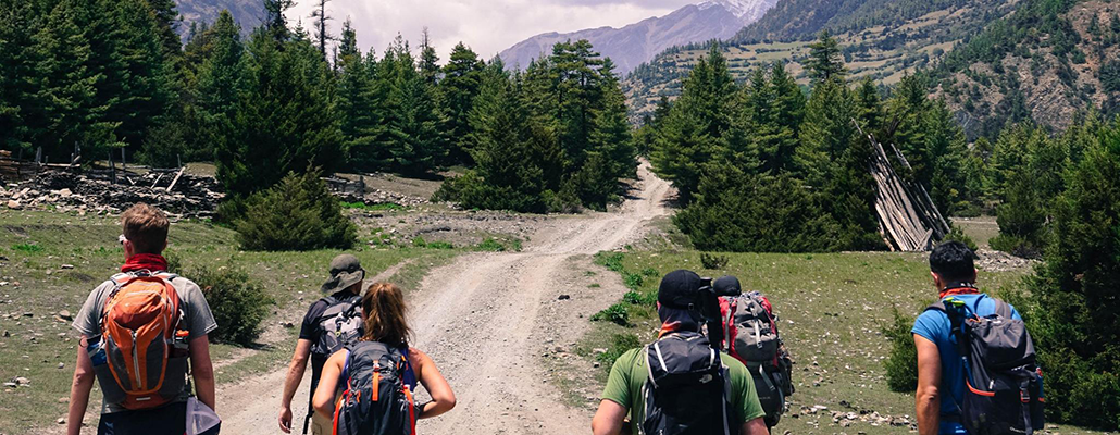 Students in the 'Life at Altitude' program walk toward distant mountains