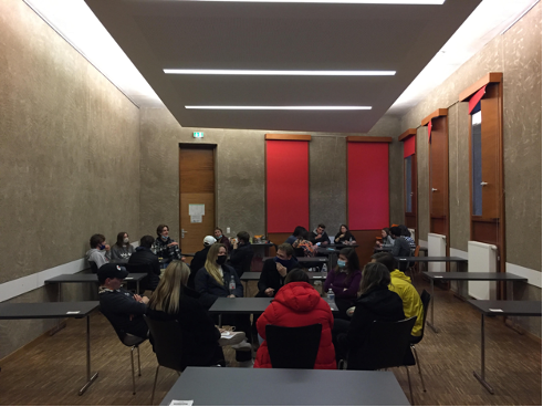 History class gathered in a conference room in the hostel.