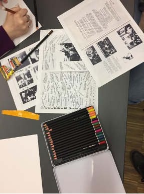 Students drawing pictures and viewing yearbook pages.