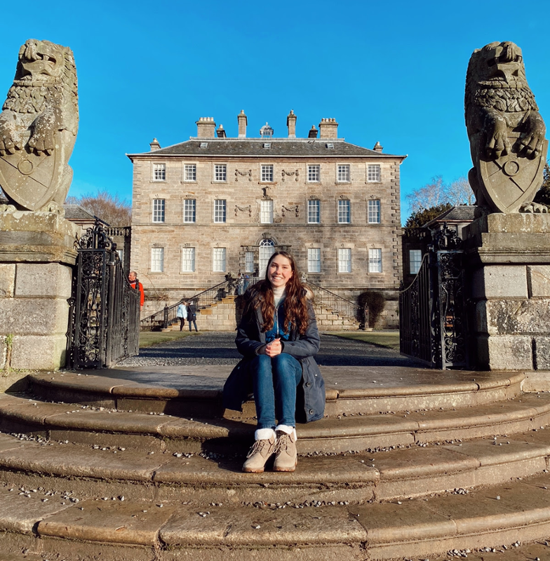 Savanna sitting on steps of University of Glasgow