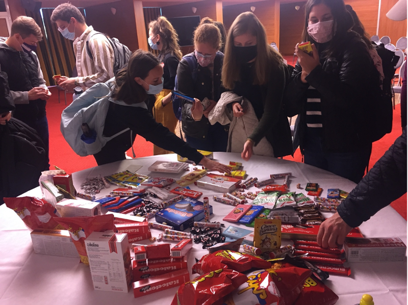HST 250 students picking through an array of retro treats from the socialist era at Zadar State Archives