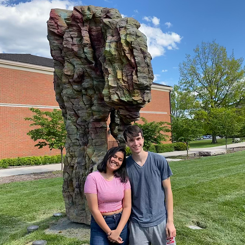 Patrick with a friend at the 'Heart in Hand' sculpture near the CPA