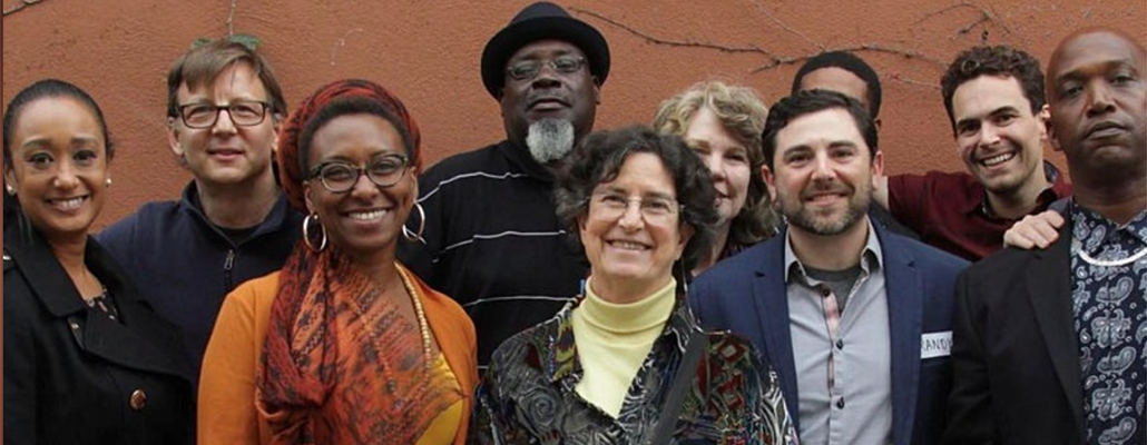 Team members from Braver Angels stand together and smile at the camera