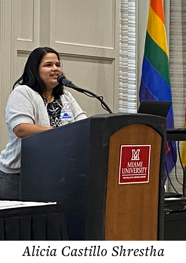 Alicia at the podium