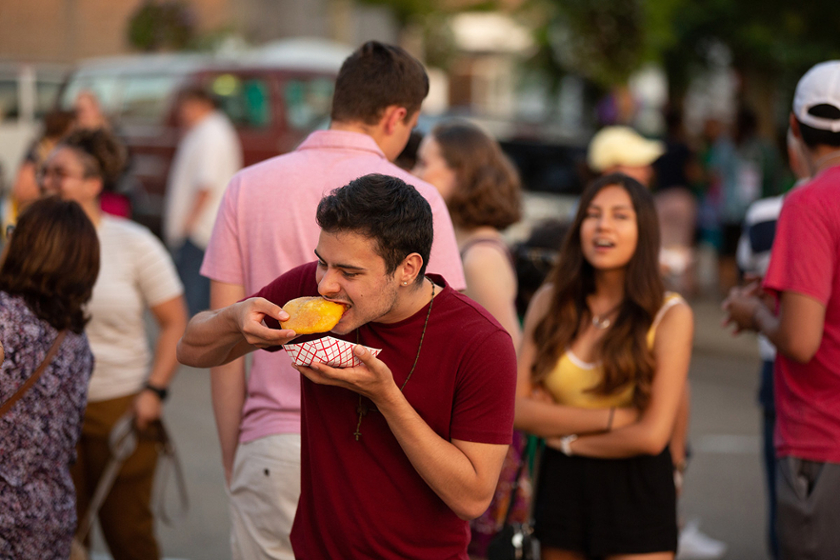 A man enjoys an empanada