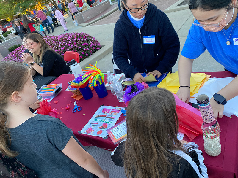 Children make crafts at the Lane Library table