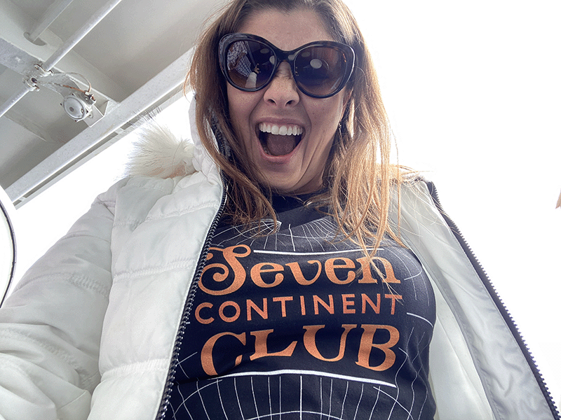 Kimberly Miller wears a t-shirt that reads '7 continents club'