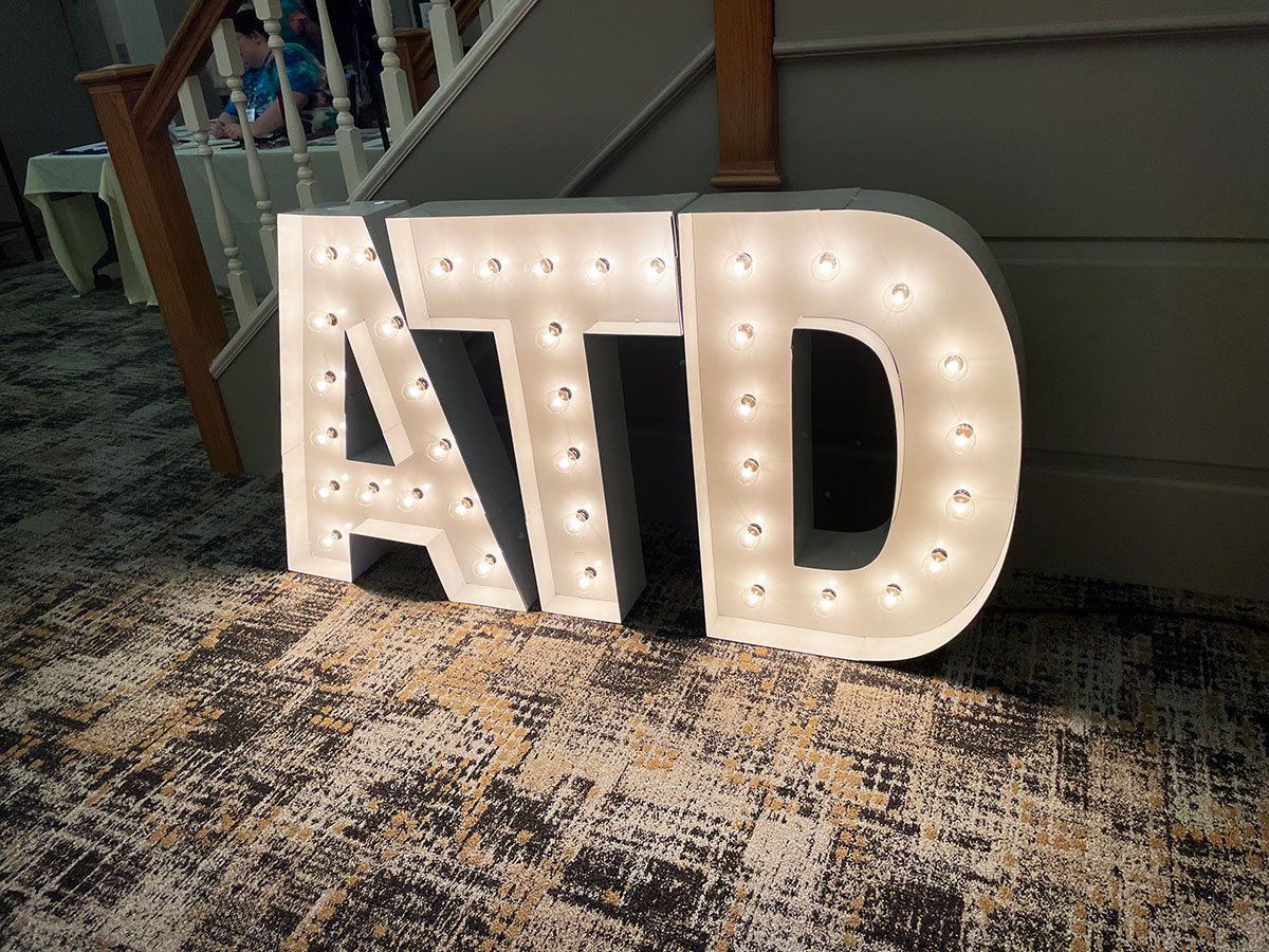 An illuminated ATD sign at the conference