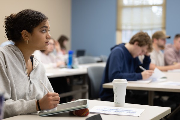 students in classroom with laptops