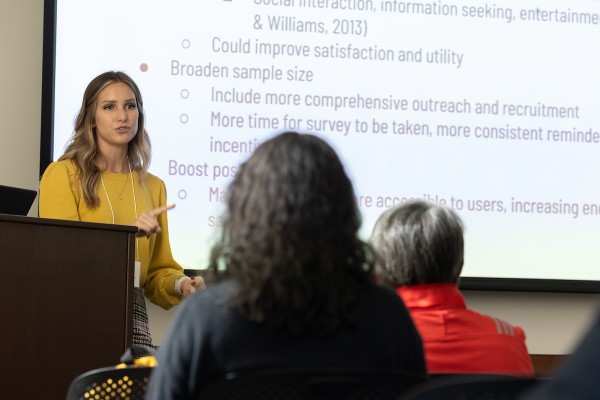 Doctoral student with cap and gown