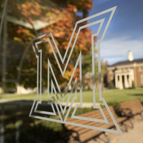 Miami University M Logo with building in background