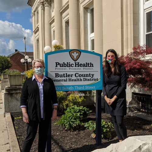 Kendall Leser and Jennifer Bailey stand in front of Butler County Public Health building