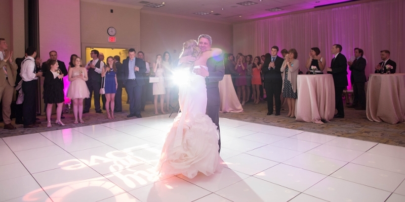 A bride and her father dancing.