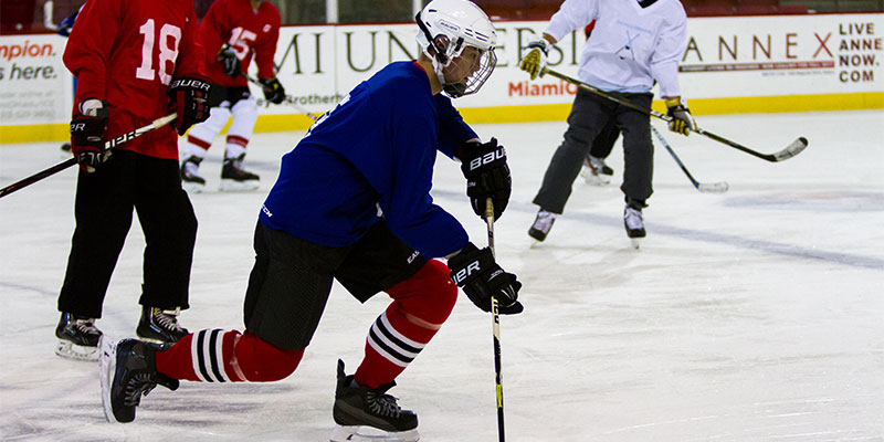 Students playing intramural hockey.