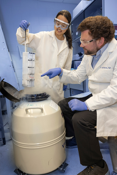 student and faculty engaged in chemistry research