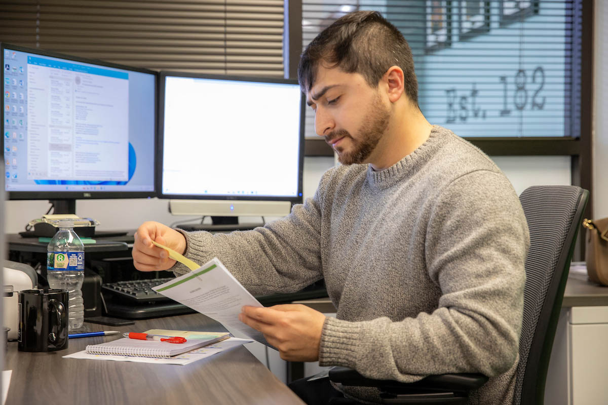 employee reviewing his work