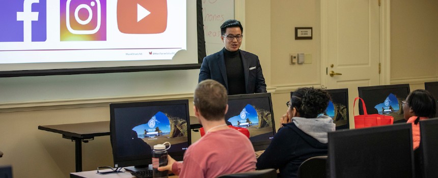 Male faculty member teaching in a classroom