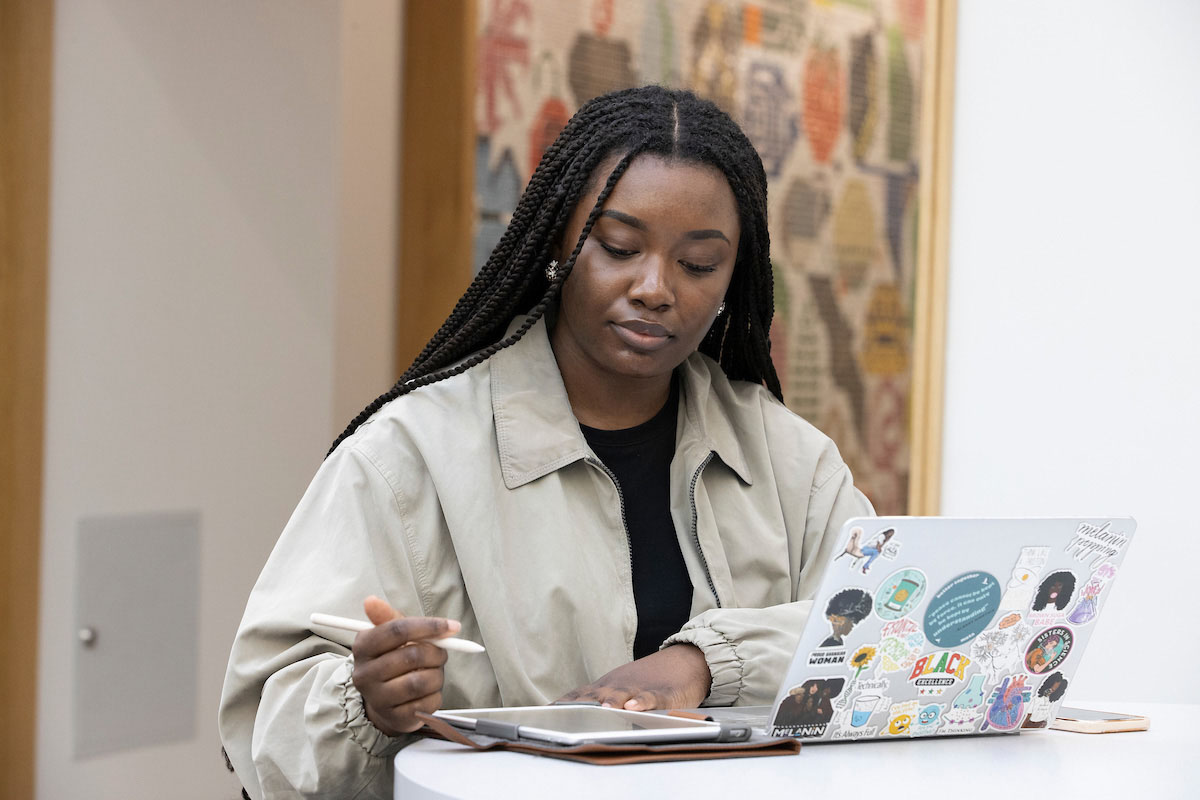 student on ipad and computer