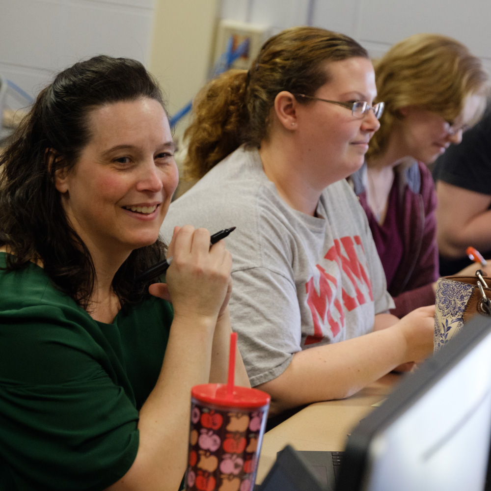 Adult female student sitting in class