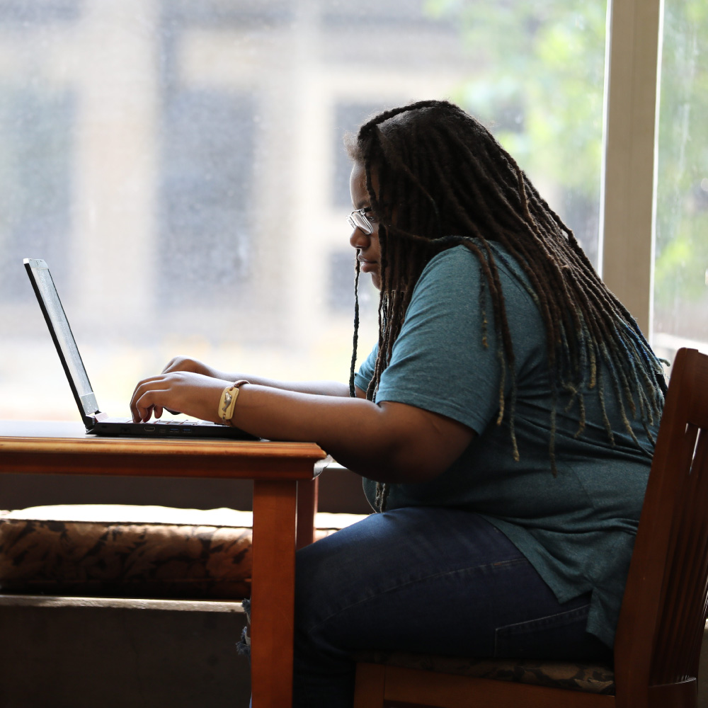 A student working on her laptop