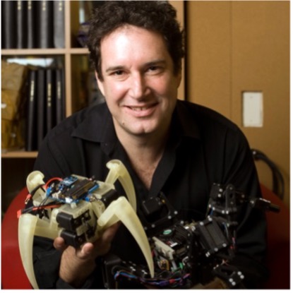 Hod Lipson holding a small robotic devise