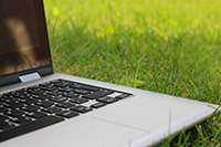 laptop sitting on the grass