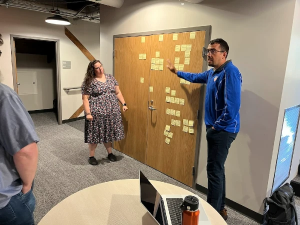 Josh Senn, IAM solution engineer, points to a set of post-it notes that would eventually become the timeline for the IAM program.